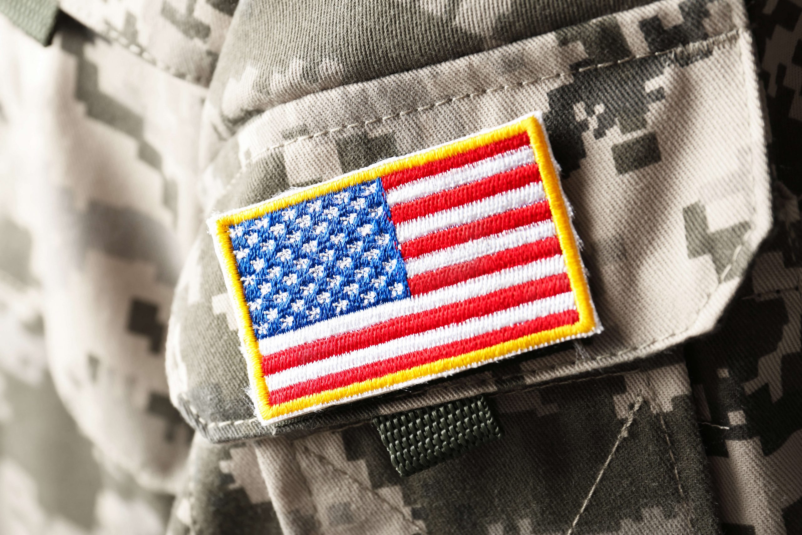 An image of military uniform and the American flag