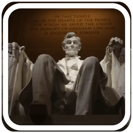 statue of Abraham Lincoln sitting in a stone carved chair