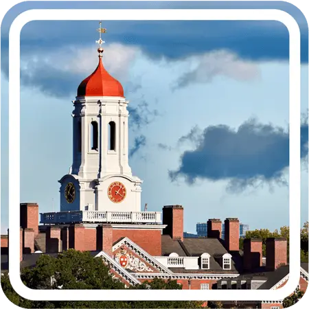 A red brick building with a clock tower topped with a red dome