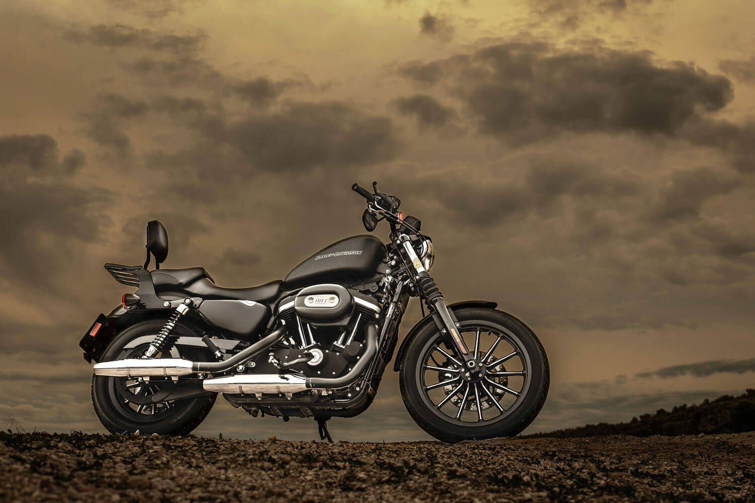 A black Harley-Davidson Iron 883 Sportster