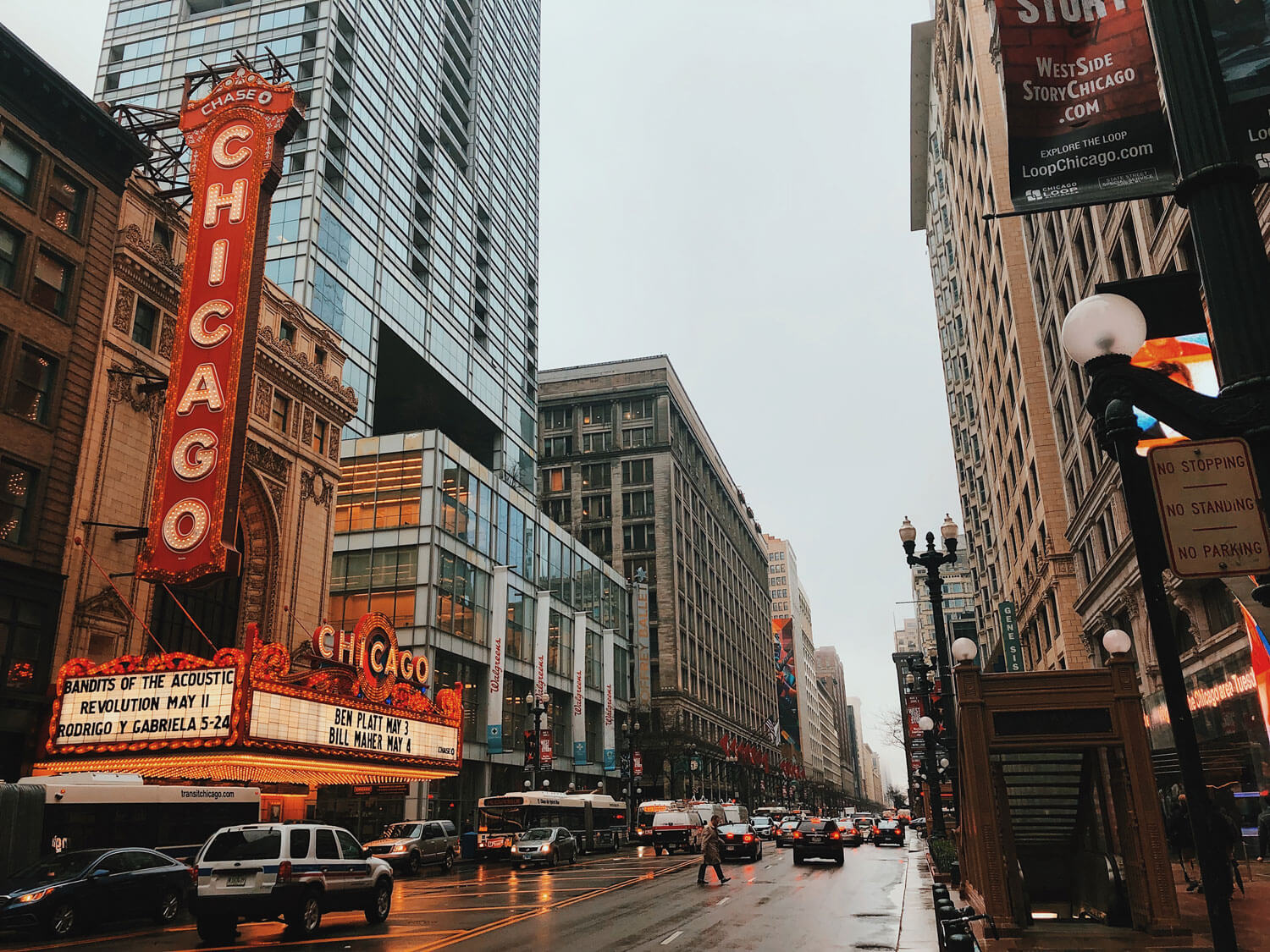 an image of a street in Chicago, featuring the Chicago Theatre in the distance